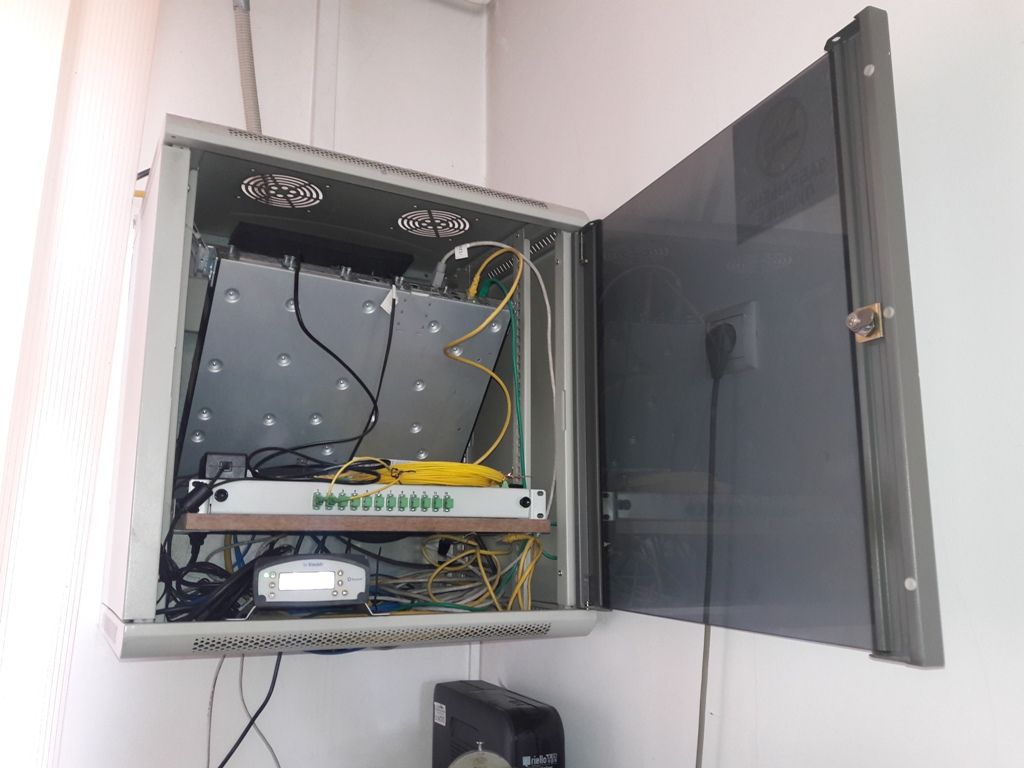 Rac cabinet with Trimble Ethernet CORS receiver of NPAZ station with belonging power supply, antenna cable and IT equipment