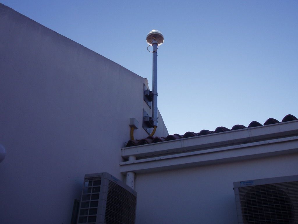 Survey Marker Bolt on the steel antenna mast, which is anchored to a wall on the roof of the cadastare building in the city of Zadar.