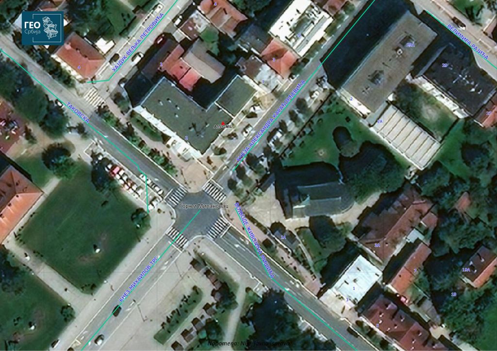 Spatial disposition of GJML station plotted on the RGA's satellite ortophoto image of Serbian NSDI. The red triangle represents the location of GNSS antenna installed on the roof of local cadastre building in municipality Gornji Milanovac