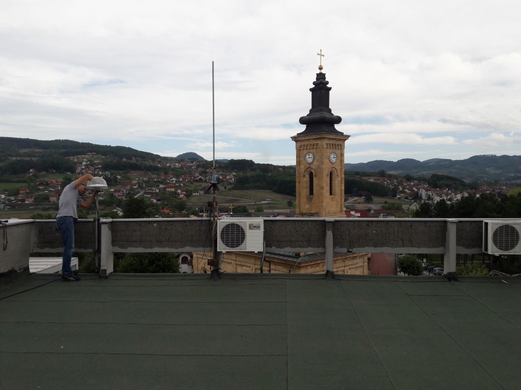 The installation of Trimble Zephyr 3 Geodetic antenna on the flat roof terrace of municipality building.